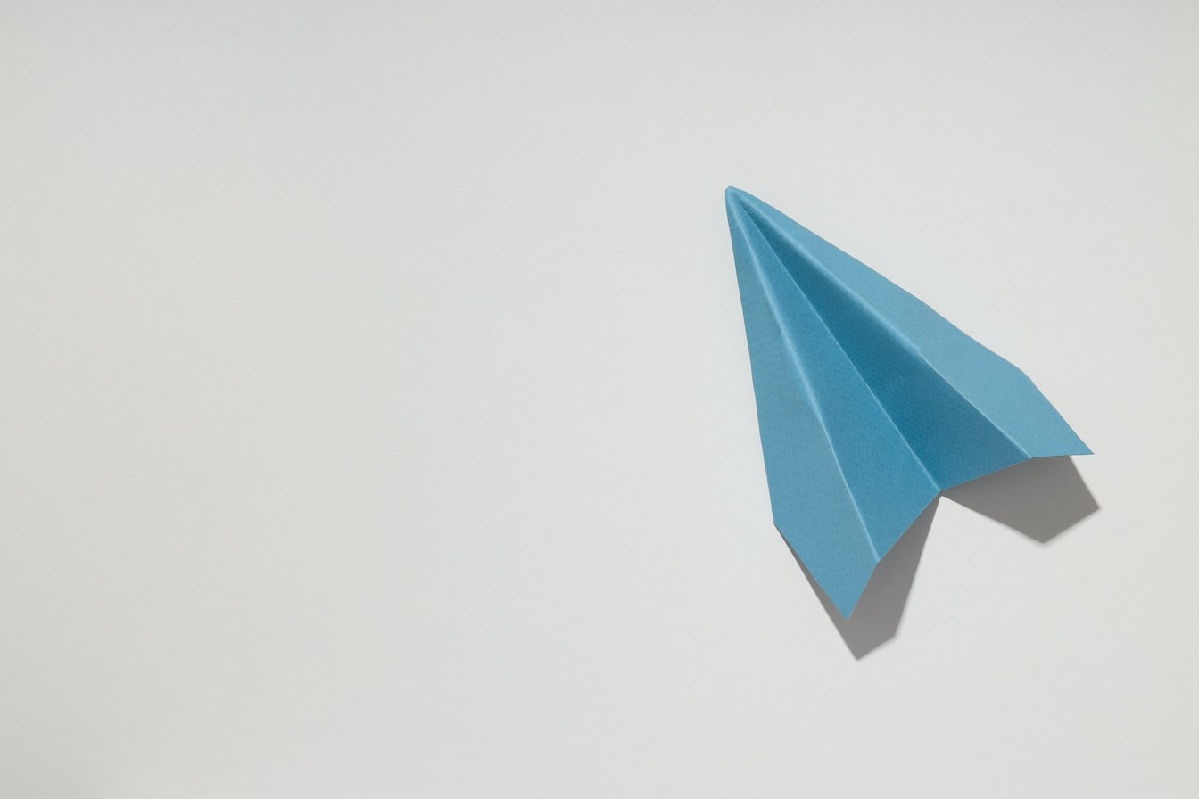 Business, Startup and Sponsorship Concept with Paper Plane on Wh